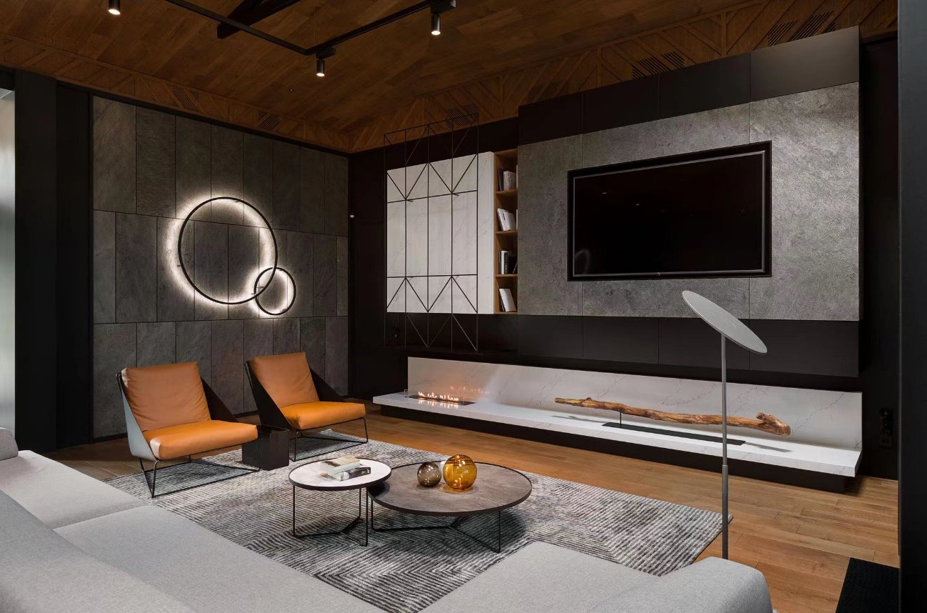 Residential living space featuring lightweight stone wall surfaces and calm natural light